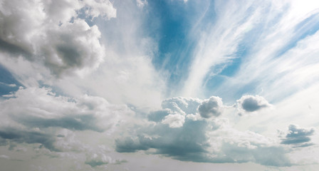 Fototapeta na wymiar White clouds in a blue fantastic sky