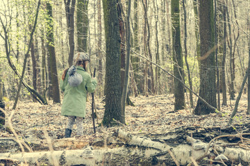 little girl goes through the woods