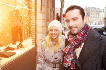 Young attractive couple doing some window shopping