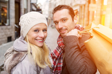 Young attractive couple with shopping bags