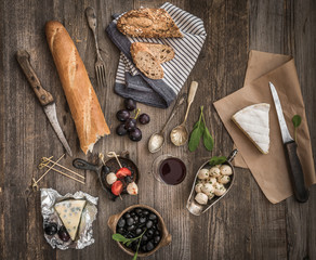 cheese and other ingredients on a wooden table