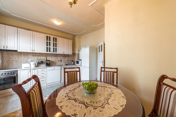 Kitchen and dining room in retro apartment interior