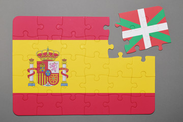 Puzzle with national flag of Spain and Basque Country piece detached.