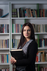 Young female student in library