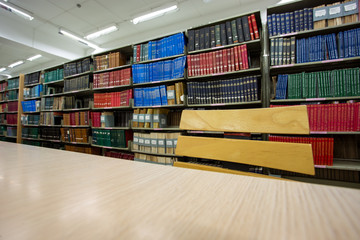 book on desk in library with book column background