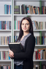 Young female student in library