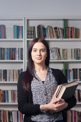 Young female student in library