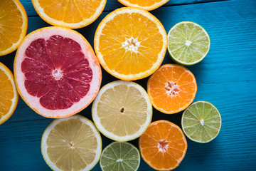 Fototapeta na wymiar fresh citrus half cut fruits overhead