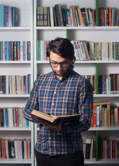 Young male student in library