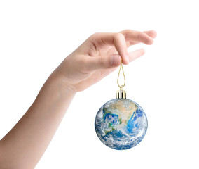 Female hand holding the planet Earth as a Christmas toy. Elements of this image furnished by NASA