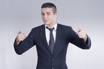 Young businessman pointing 