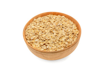 Oatmeal flakes in a wooden bowl isolated on white background