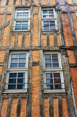 Obraz premium timber-framed building windows in Troyes, France.
