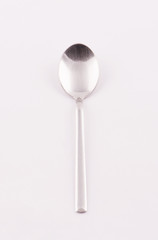 Small spoon on white background