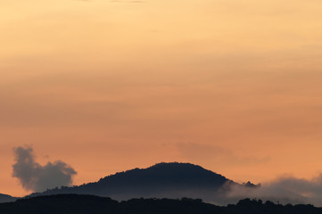 Hills with fog at sunrise