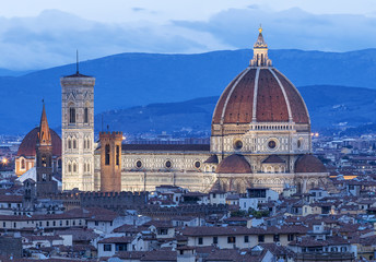 Fototapeta na wymiar belfry and cathedral in Florence in the morning twilight in Italy