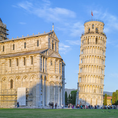 Tower of Pisa and cathedral in the sun light in Italy 