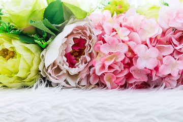 Colorful artificial flowers texture, background