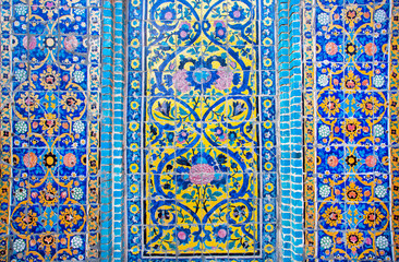 Pattern with colorul flowers on the tile on the wall in Iran