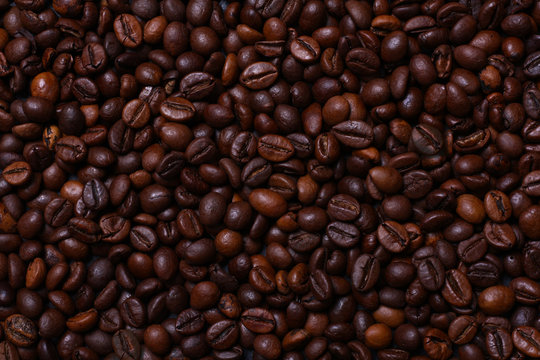 Brown coffee beans, close-up of coffee beans for background and texture