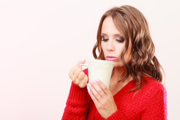 Autumn woman holds mug with coffee warm beverage