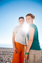 Young couple posing on the beach