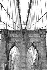 Brooklyn Bridge against sky black and white