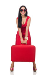 Fototapeta premium Woman in red dress with suitcase on white