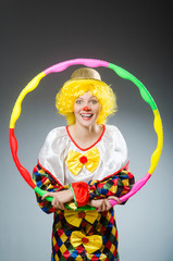 Clown in funny concept on dark background