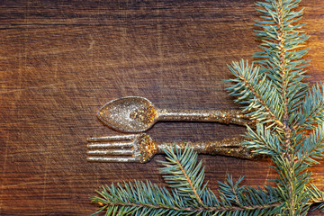 Christmas tree with Christmas decorations on wooden background