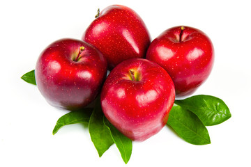 fresh red apples with leaves isolated on white background