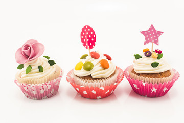 Three cupcakes on a white background