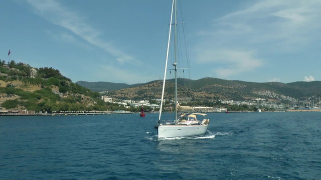 Sailing yacht running along the Turkish coast, Bodrum.
