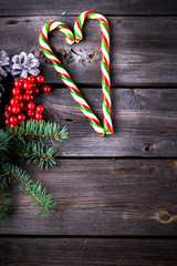  Xmas wreath card  with copyspace on wooden background.