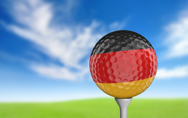 Golf ball with Germany flag colors sitting on a tee