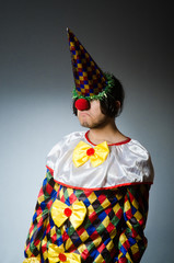 Funny clown against dark background