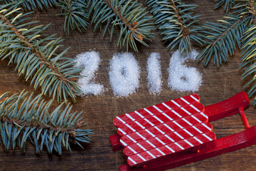 Happy new year 2016 written sugar on wooden background