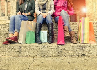 Young girls sitting and chatting after shopping in city  - Shopping and travelling concept - Warm...