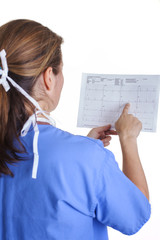 lab technician in scrubs and mask holding EKG results shot from the back on a white background portrait close-up