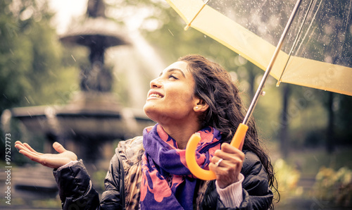 Happy woman under the rain