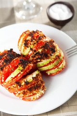 Baked tomatos with zucchini