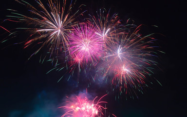 The fireworks display in black sky background to celebration