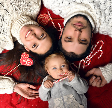 Christmas Family with small baby infant Kid lying on the floor