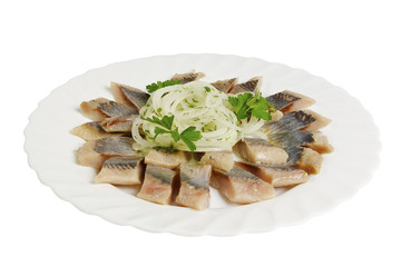 Herring salad with onion on the plate, isolated