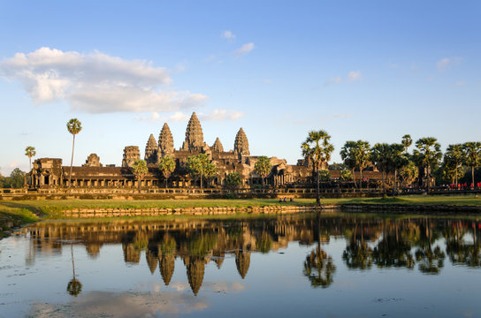 Angkor Wat at sunset with reflection in water