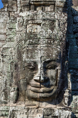 Fototapeta na wymiar Ancient stone face of Bayon temple in Angkor Thom