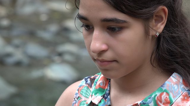 Sad Teenage Girl near River