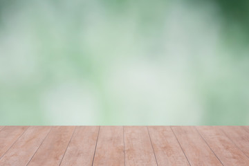Wood table top on green bokeh abstract background. ready for product display