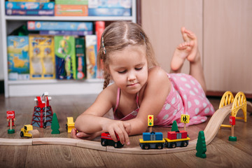 Girl play with a toy train