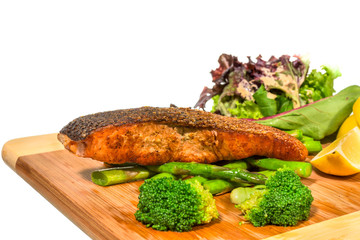 Grilled Salmon with Fresh Salad Leaf on white background